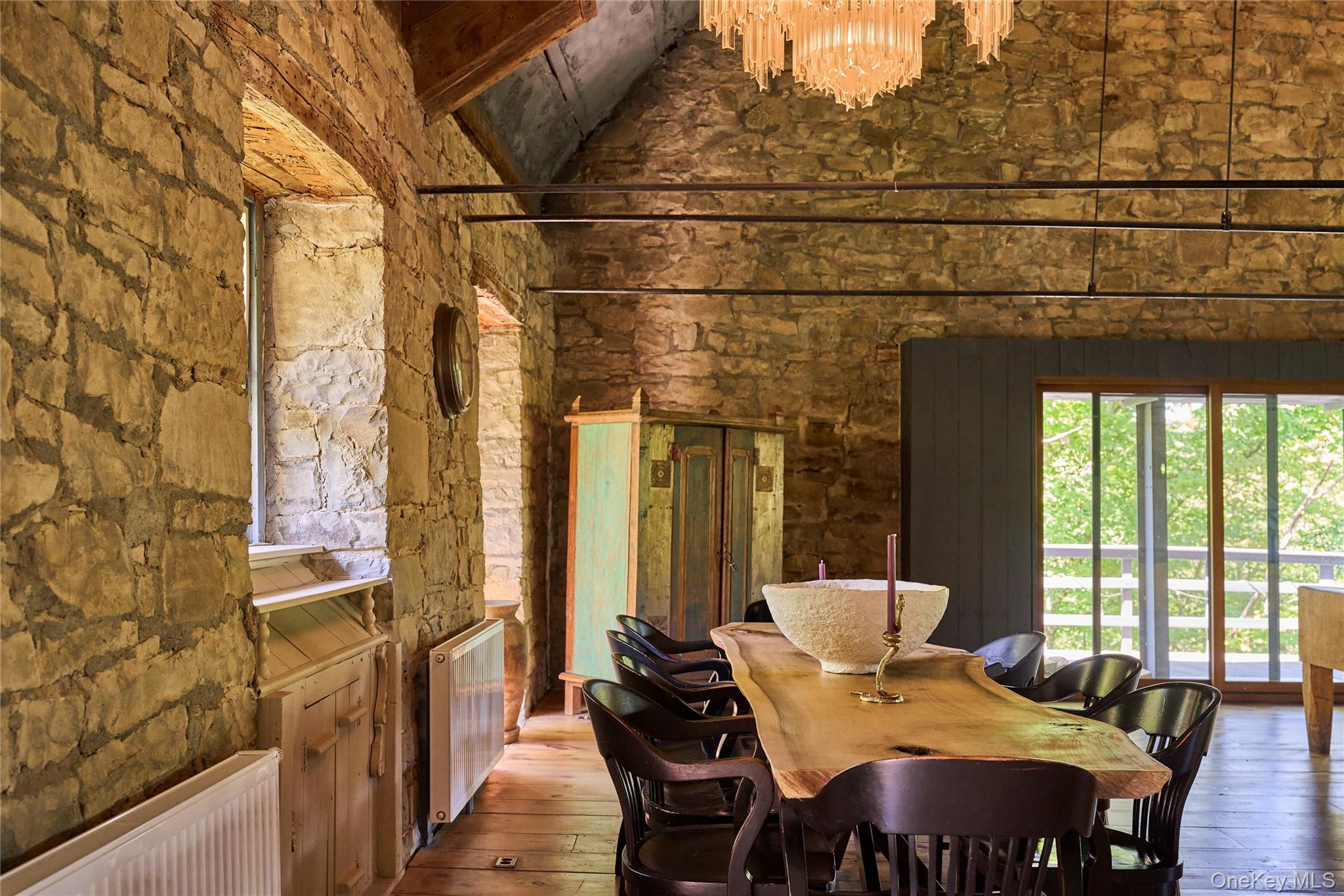 1883 Highway 213 Rifton, NY 12471 - Photo 4 of 48 Dining space featuring radiator, hardwood / wood-style floors, a high ceiling, and a chandelier