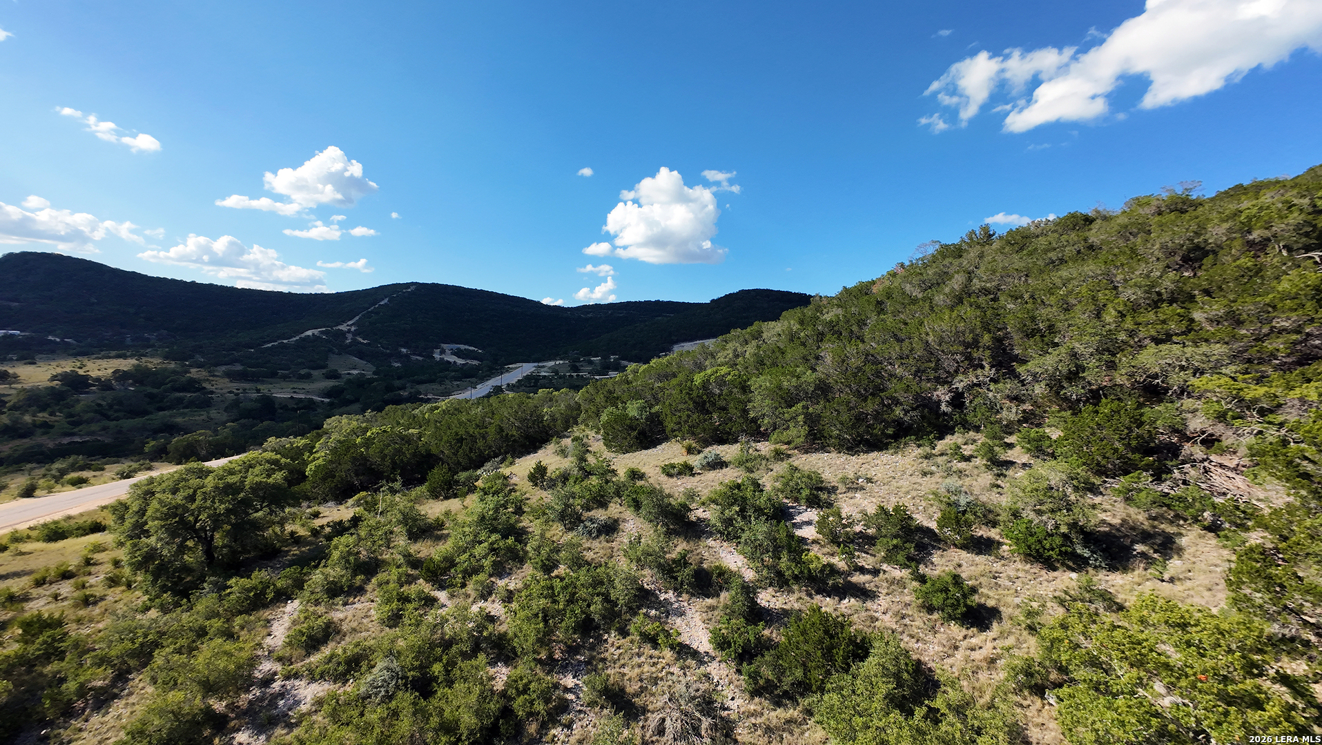 Lot 42 Walker Ridge Tarpley, TX 78003 - Photo 4 of 10 a view of a yard with a flower garden