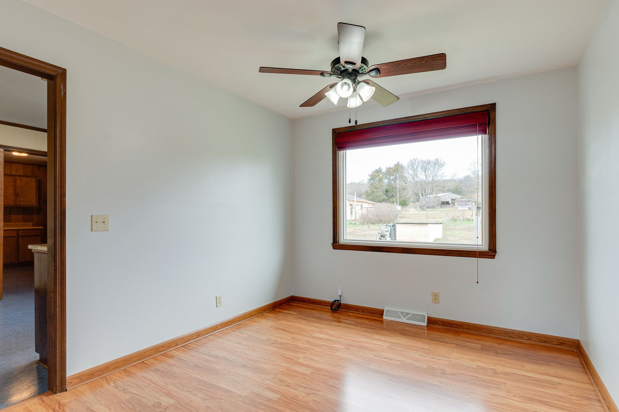 765 Lindsley Road Lebanon, TN 37090 - Photo 13 of 32 a view of empty room with wooden floor and fan