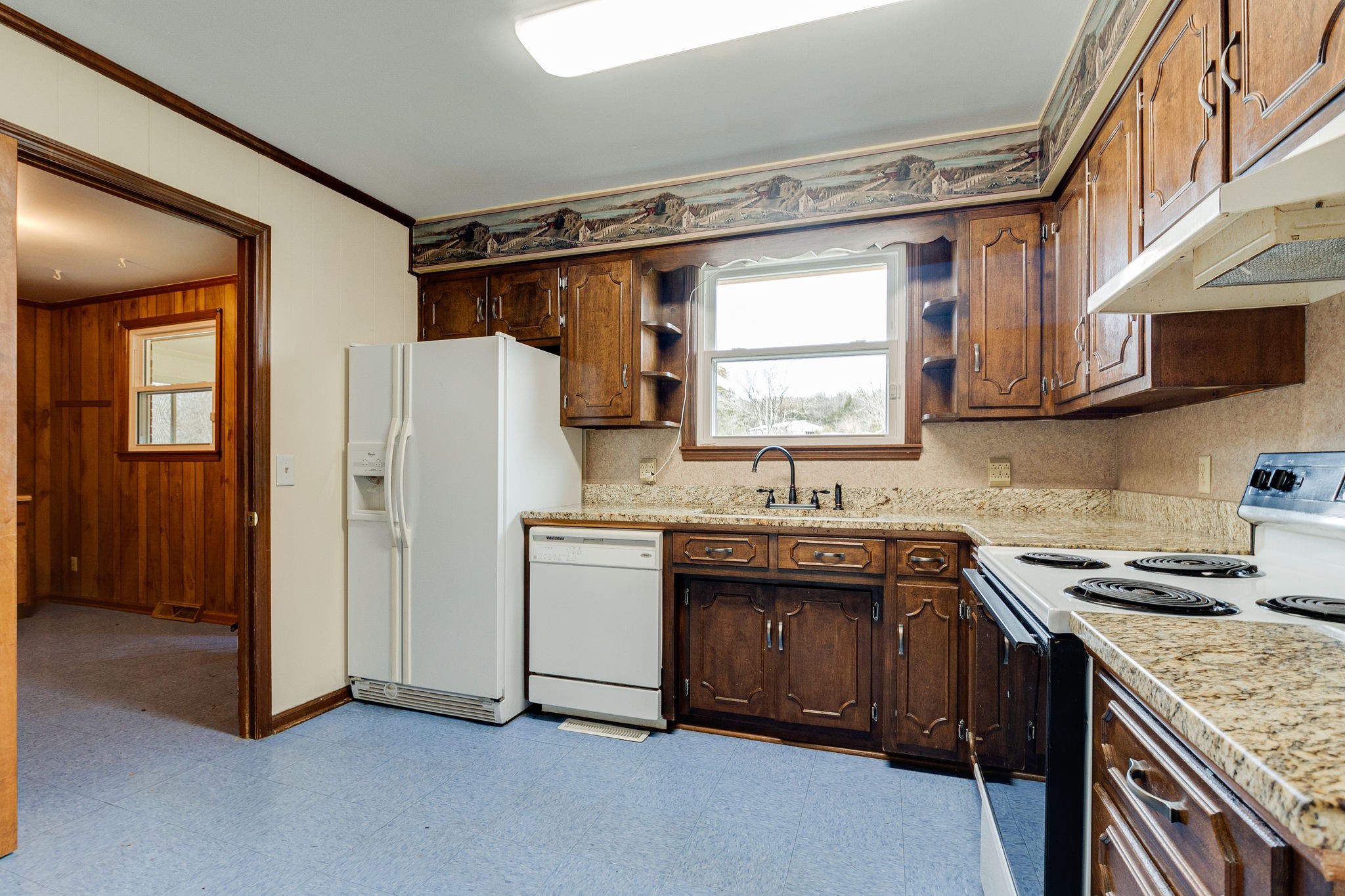 765 Lindsley Road Lebanon, TN 37090 - Photo 15 of 32 a kitchen with stainless steel appliances granite countertop a sink stove and refrigerator