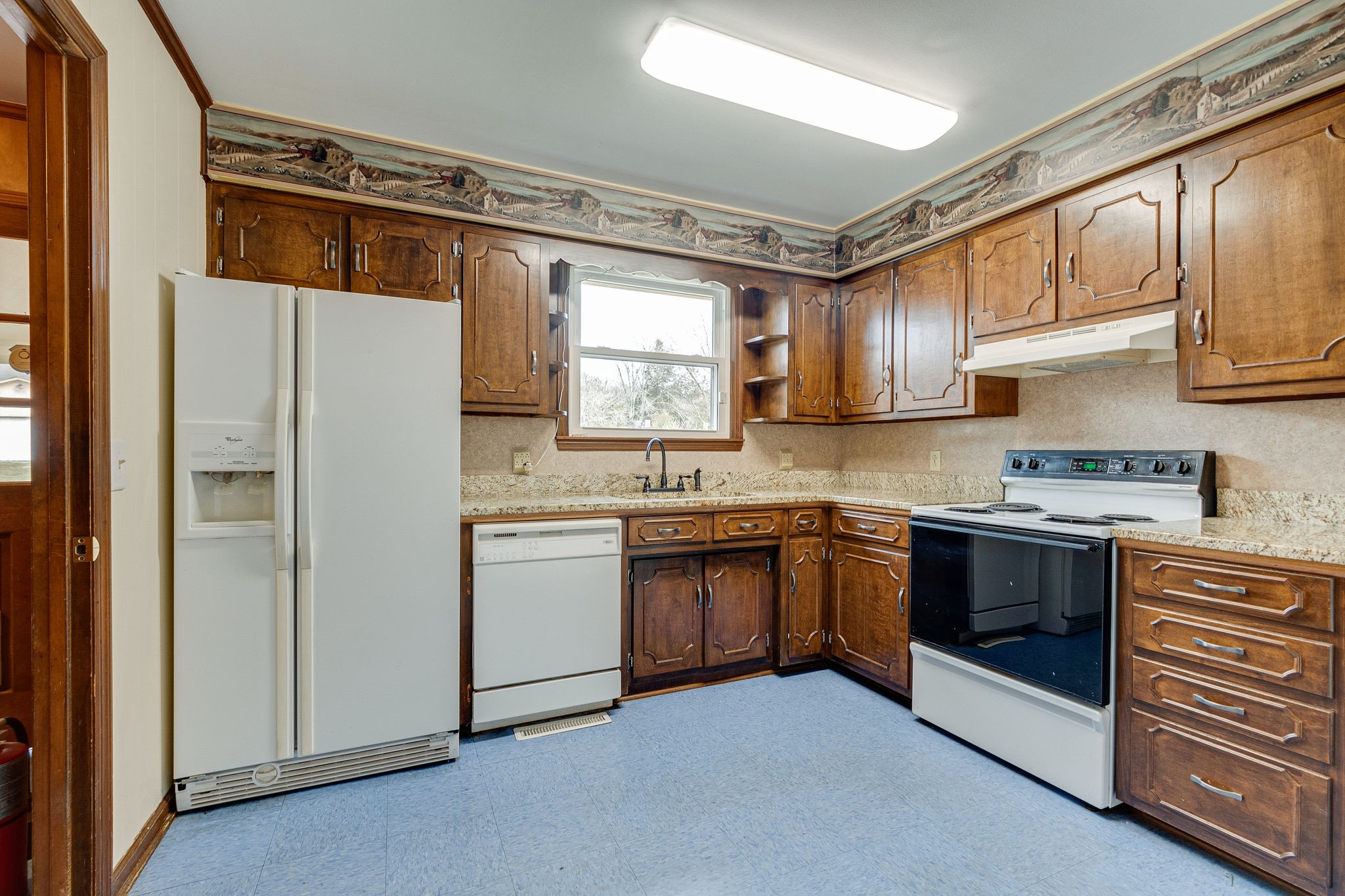 765 Lindsley Road Lebanon, TN 37090 - Photo 16 of 32 a kitchen with stainless steel appliances granite countertop a refrigerator and a stove top oven
