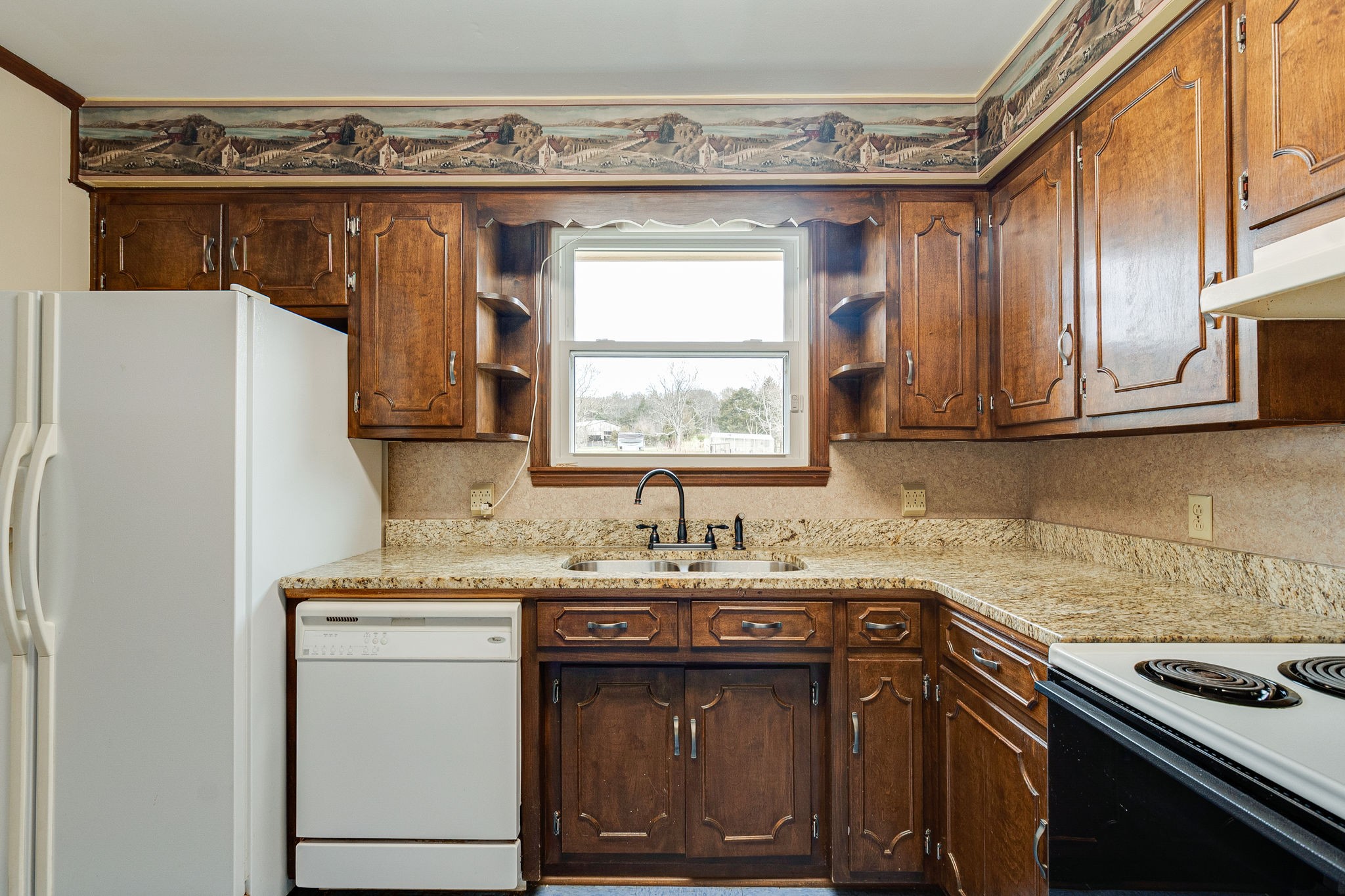 765 Lindsley Road Lebanon, TN 37090 - Photo 17 of 32 a kitchen with stainless steel appliances a sink stove and cabinets