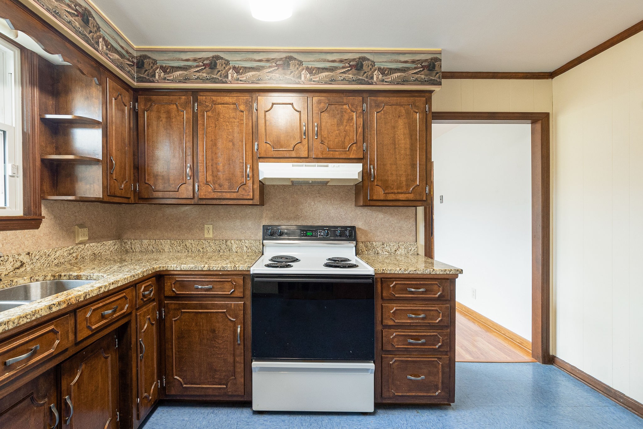 765 Lindsley Road Lebanon, TN 37090 - Photo 18 of 32 a kitchen with stainless steel appliances granite countertop a stove and a refrigerator