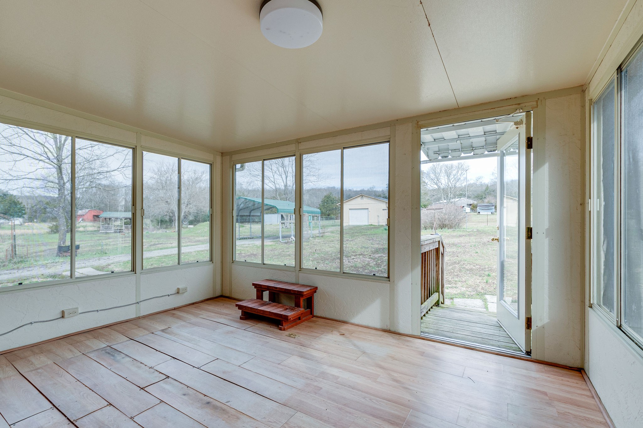 765 Lindsley Road Lebanon, TN 37090 - Photo 26 of 32 a living room with furniture and a floor to ceiling window