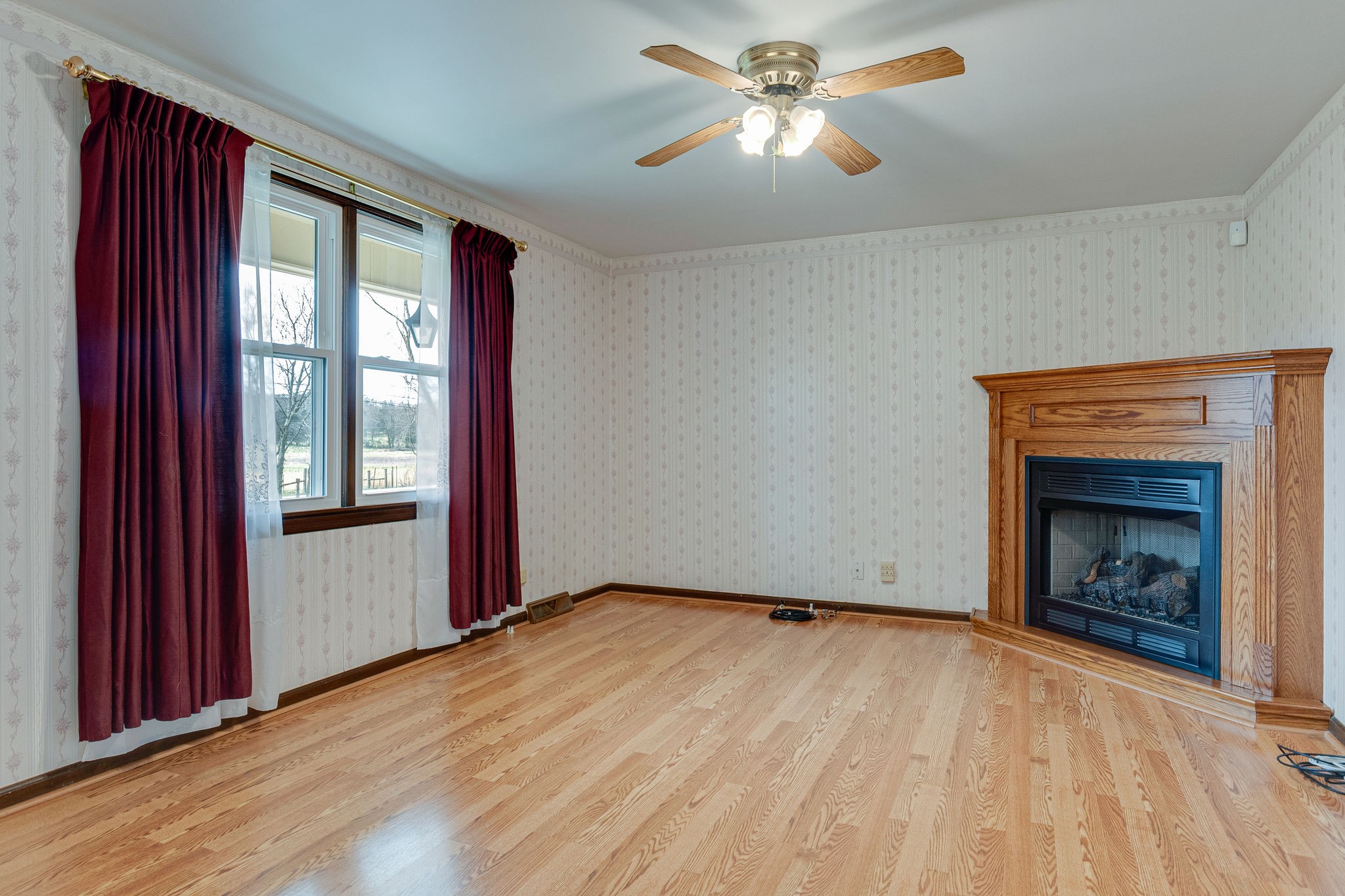 765 Lindsley Road Lebanon, TN 37090 - Photo 9 of 32 a view of empty room with wooden floor and fan
