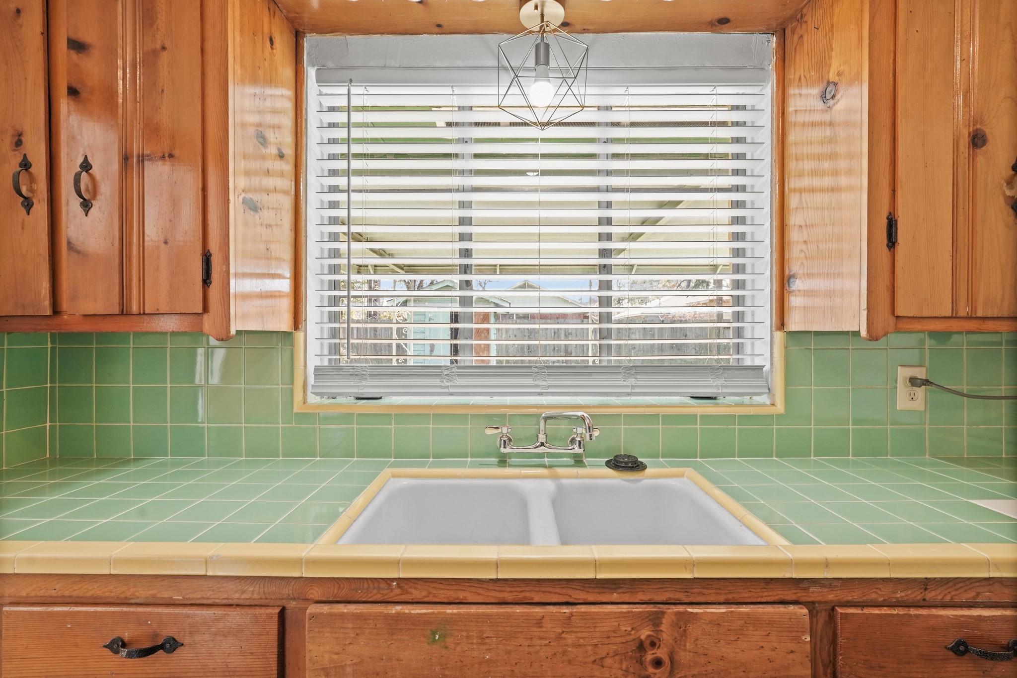 1207 Stonecrest Drive Houston, TX 77018 - Photo 20 of 34 a view of a kitchen with a window and a potted plant