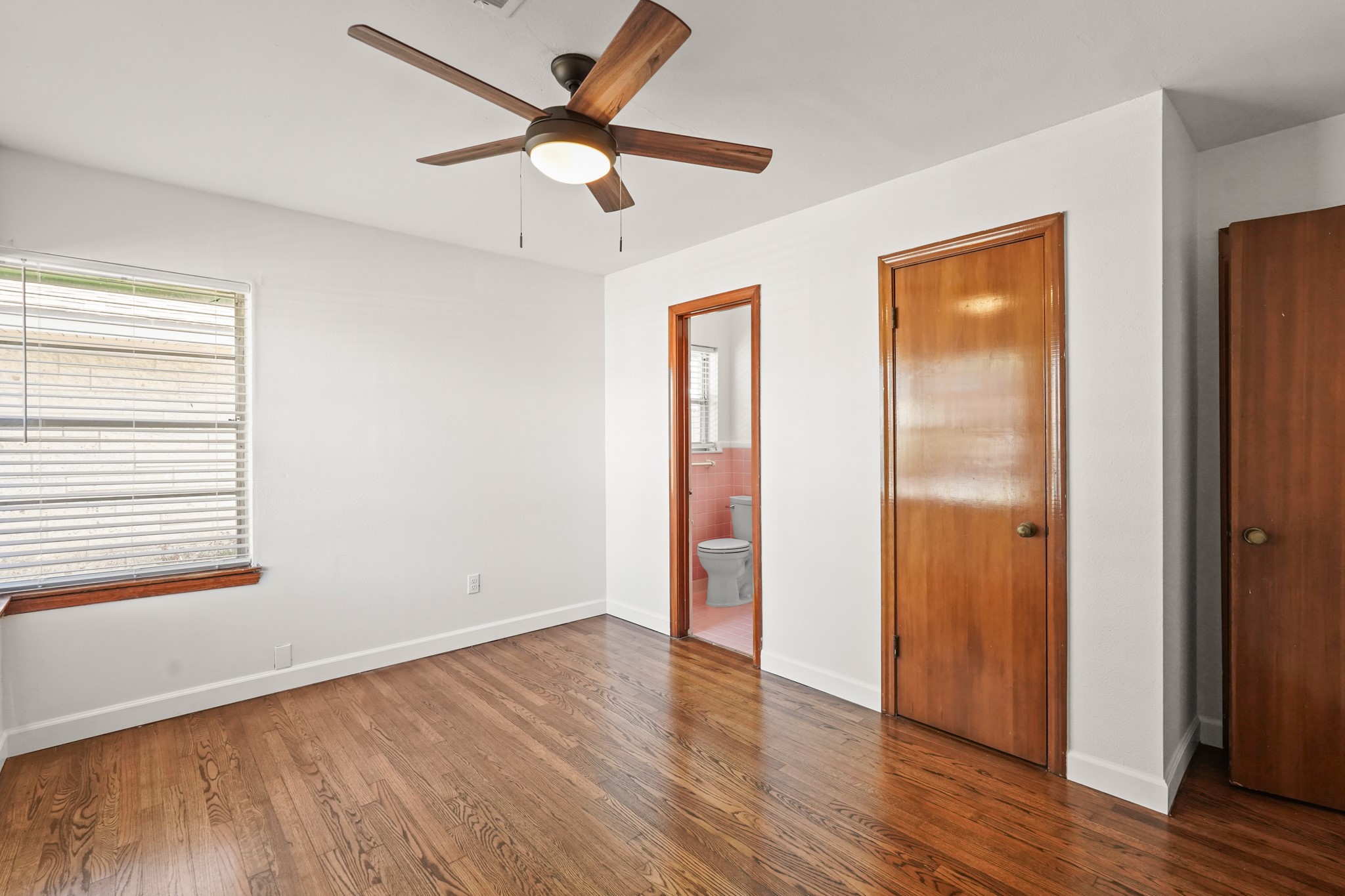 1207 Stonecrest Drive Houston, TX 77018 - Photo 28 of 34 an empty room with wooden floor closet and windows