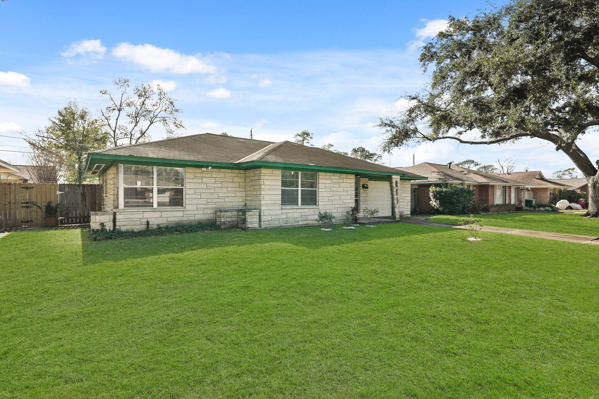 1207 Stonecrest Drive Houston, TX 77018 - Photo 3 of 34 a front view of a house with a garden
