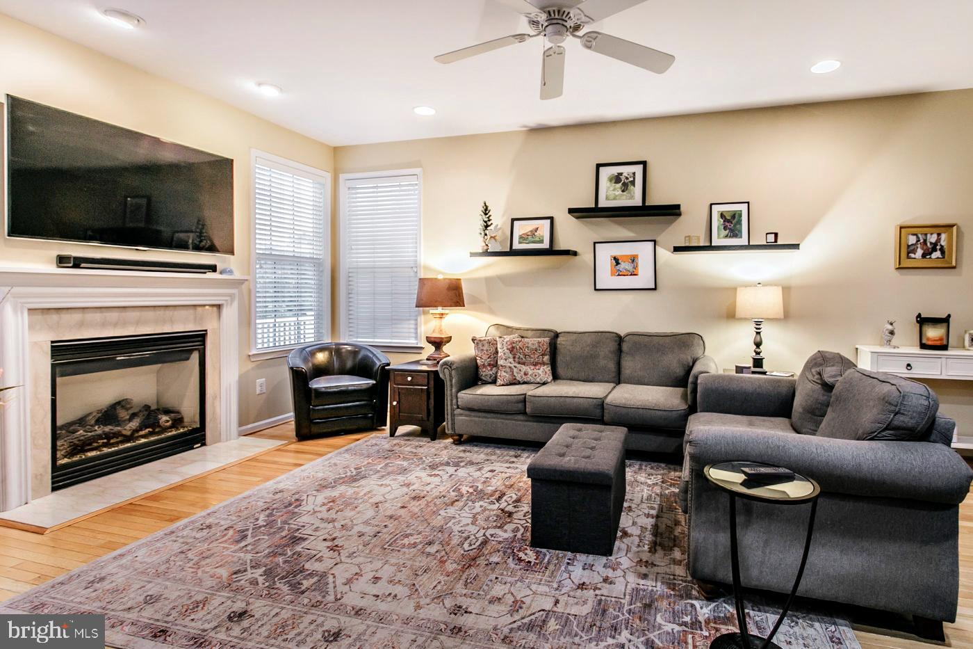 29 Eagle Road Phoenixville, PA 19460 - Photo 14 of 45 a living room with furniture a flat screen tv and a fireplace