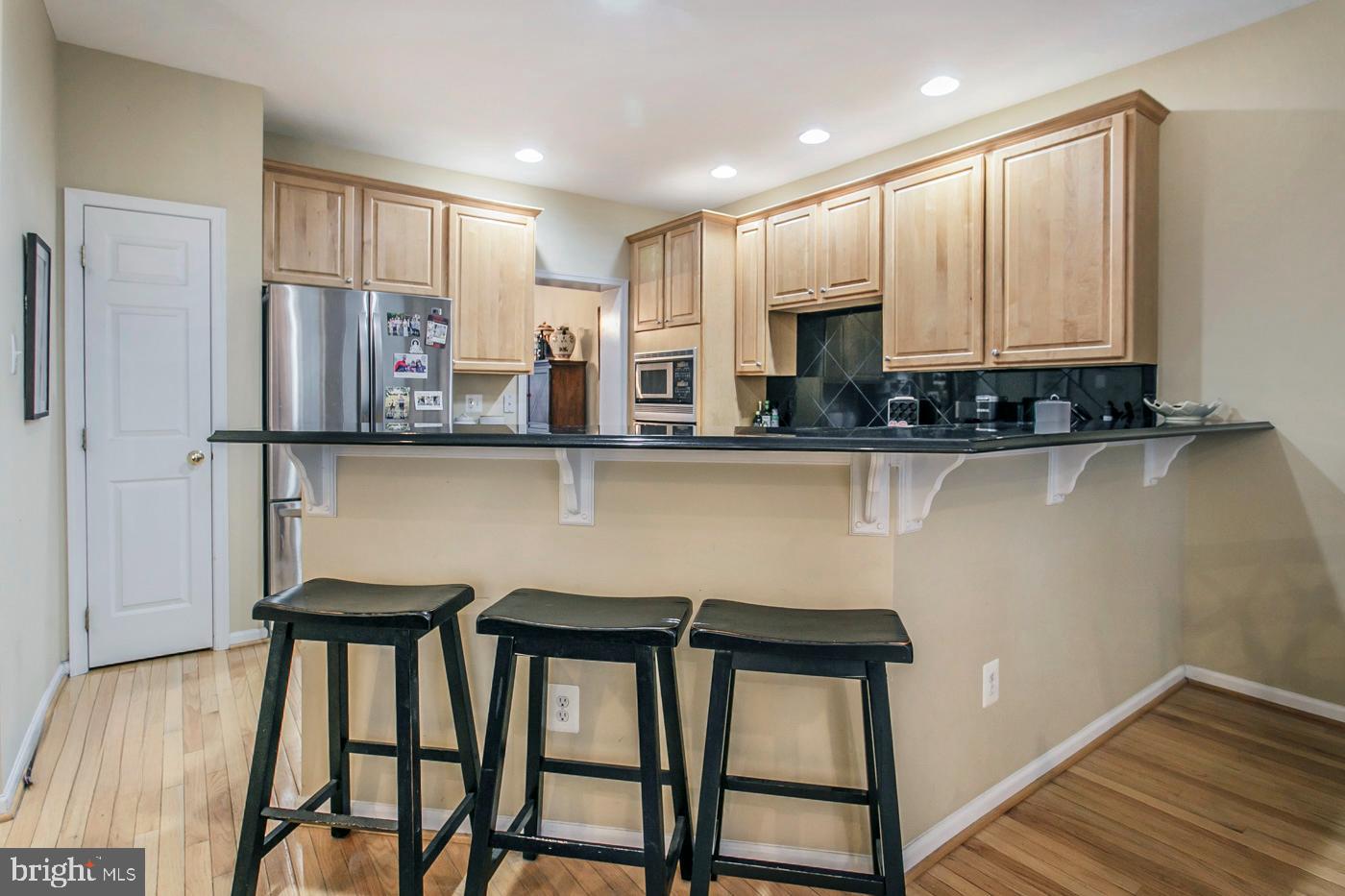 29 Eagle Road Phoenixville, PA 19460 - Photo 16 of 45 a kitchen with stainless steel appliances granite countertop a stove top oven a sink and cabinets