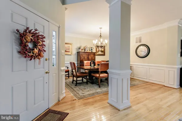 a view of living room filled with furniture and wooden floor