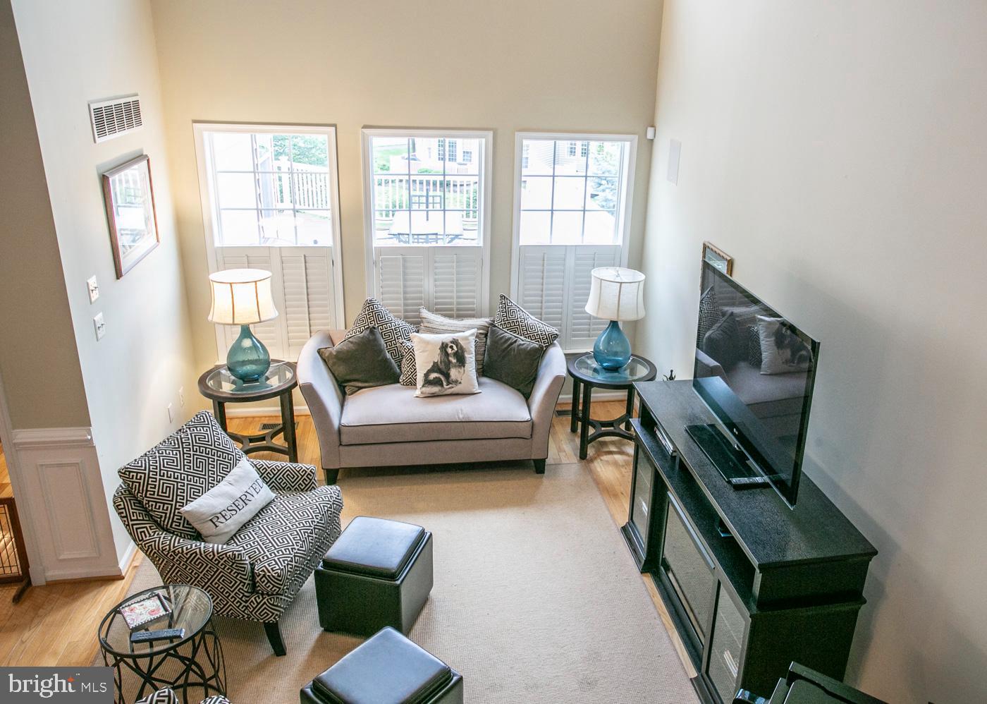 29 Eagle Road Phoenixville, PA 19460 - Photo 24 of 45 a living room with furniture and a flat screen tv