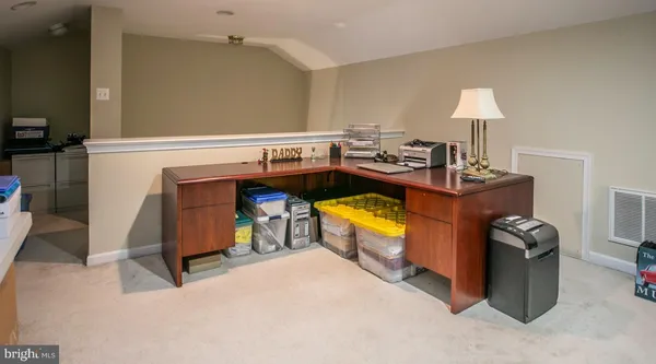 a view of a room with a fridge and a sink