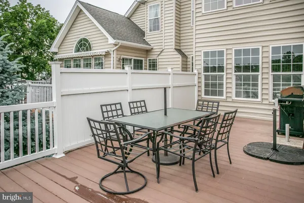 a view of a house with patio and wooden floor