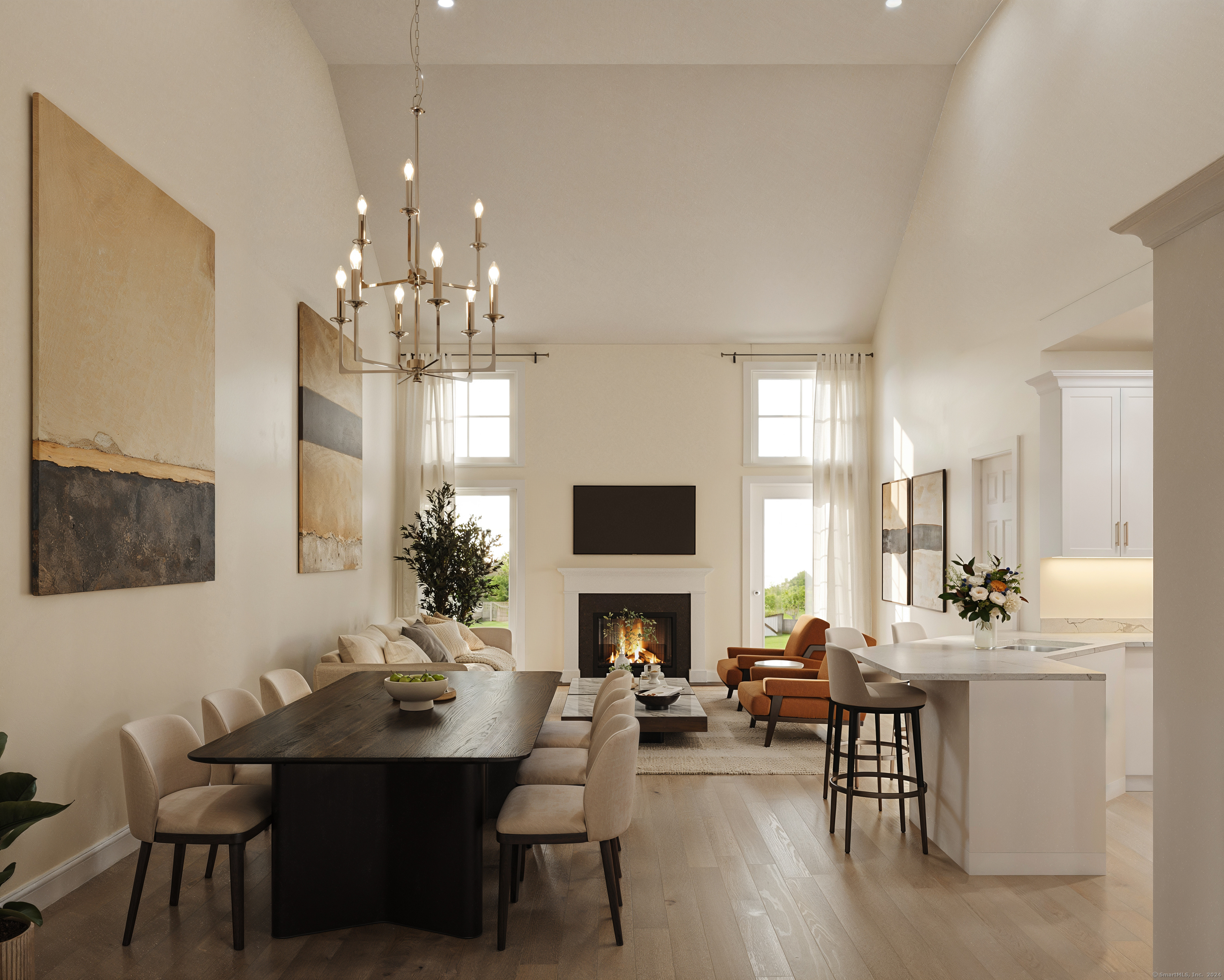 a living room with furniture a fireplace and a chandelier