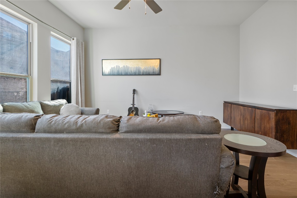 13001 Hymeadow Drive, Unit 31 Austin, TX 78729 - Photo 11 of 40 Living room featuring wood finished floors and a ceiling fan