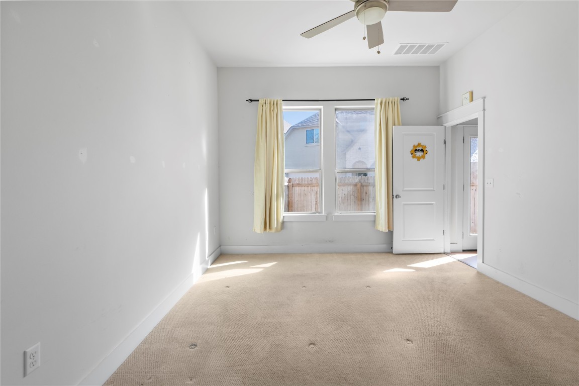 13001 Hymeadow Drive, Unit 31 Austin, TX 78729 - Photo 17 of 40 Carpeted spare room with a ceiling fan and baseboards