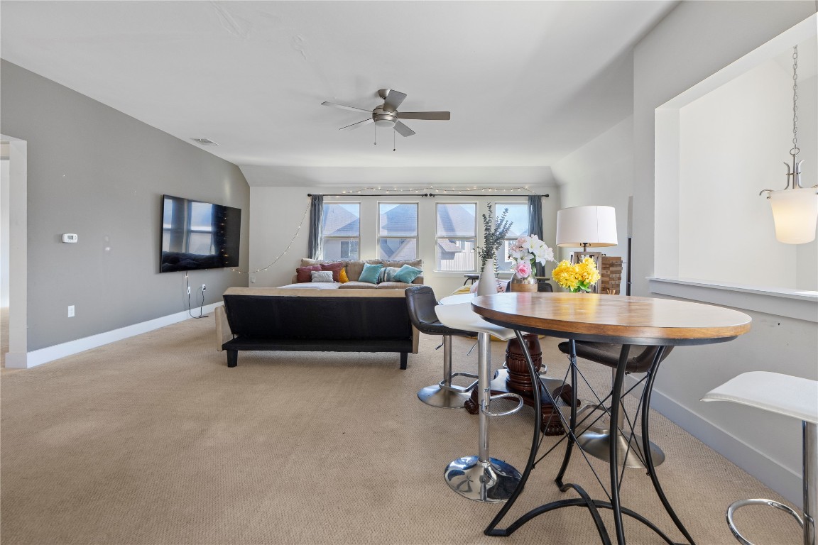 13001 Hymeadow Drive, Unit 31 Austin, TX 78729 - Photo 22 of 40 Living room with light carpet and a ceiling fan