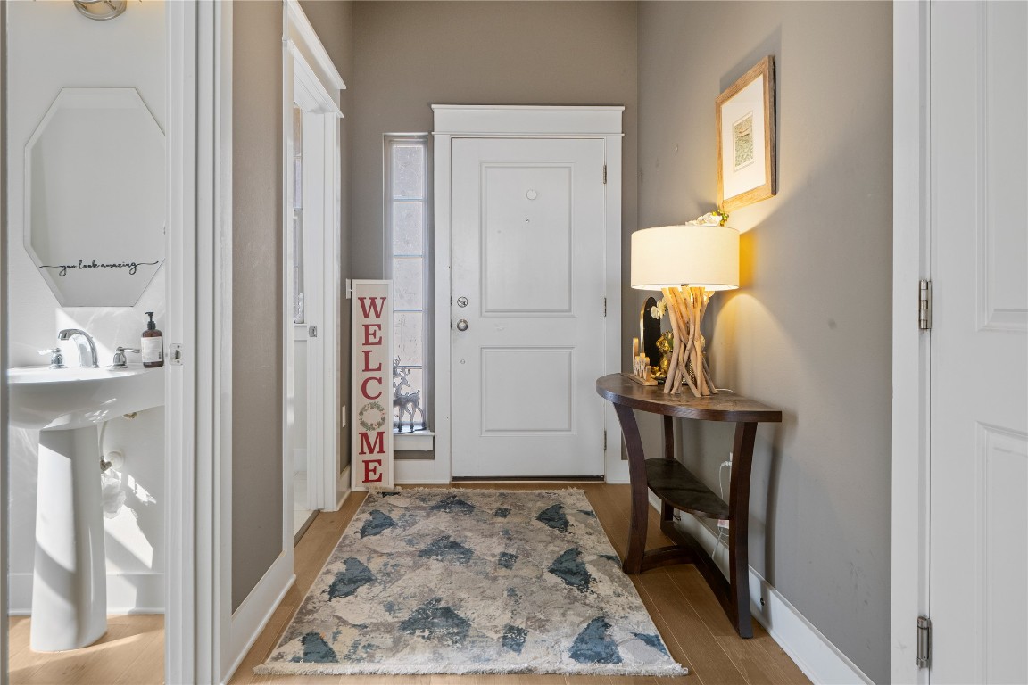 13001 Hymeadow Drive, Unit 31 Austin, TX 78729 - Photo 3 of 40 Entryway featuring light wood-type flooring and baseboards