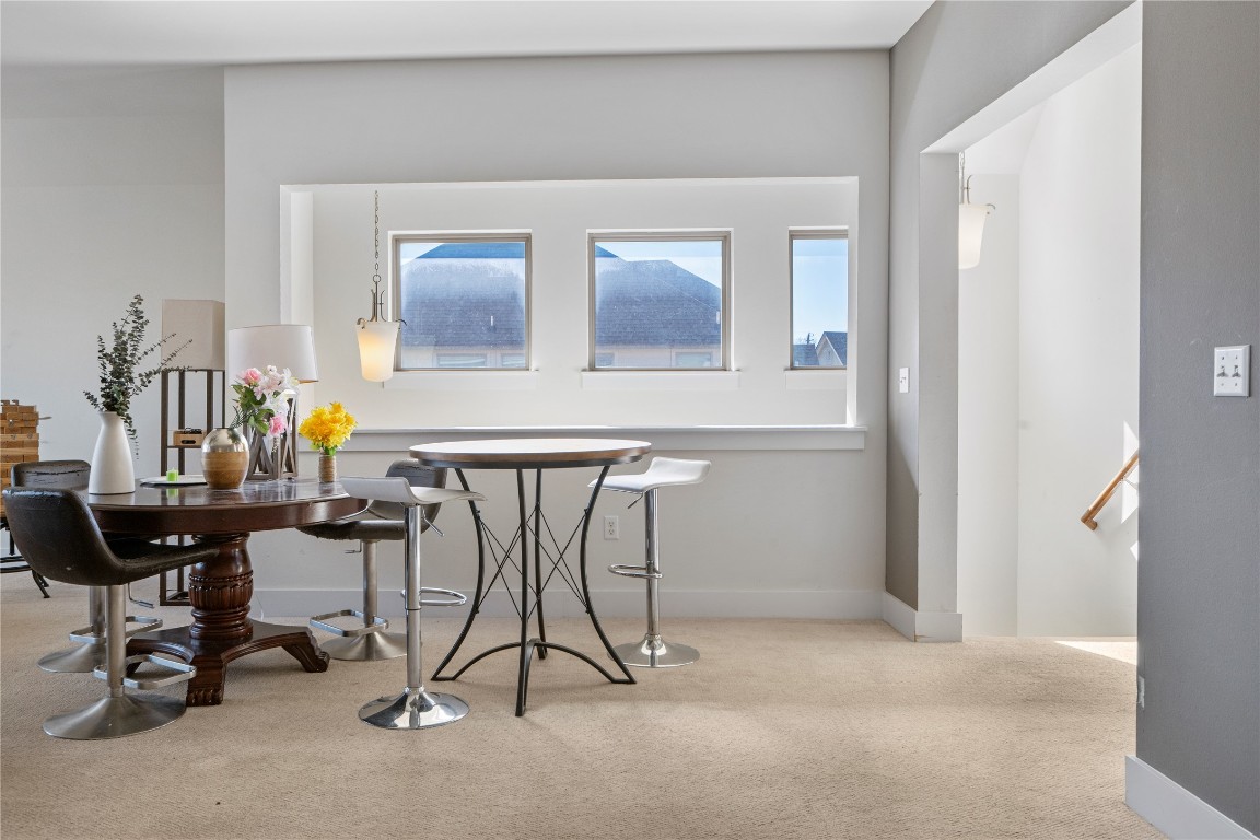 13001 Hymeadow Drive, Unit 31 Austin, TX 78729 - Photo 34 of 40 Dining area featuring light carpet and baseboards