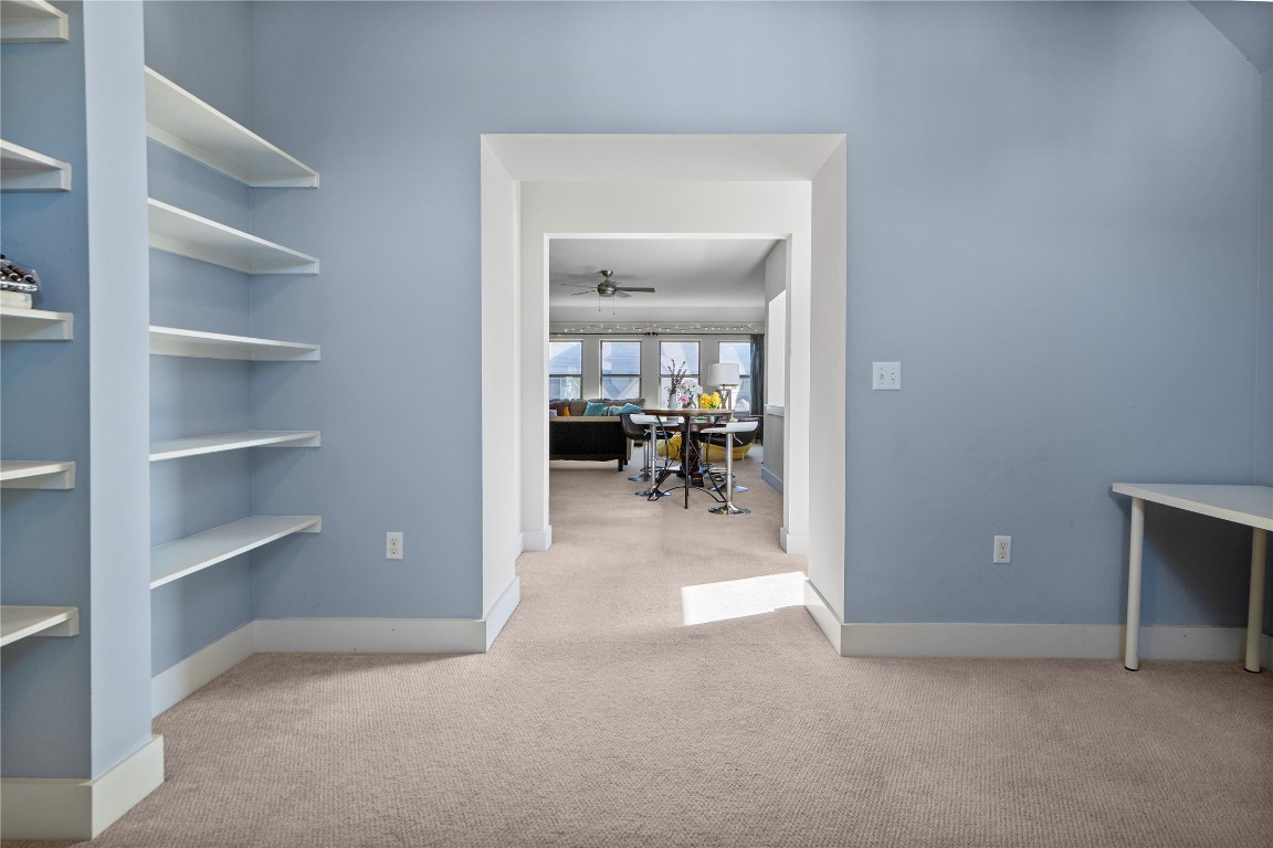 13001 Hymeadow Drive, Unit 31 Austin, TX 78729 - Photo 35 of 40 Office area with light colored carpet and a ceiling fan