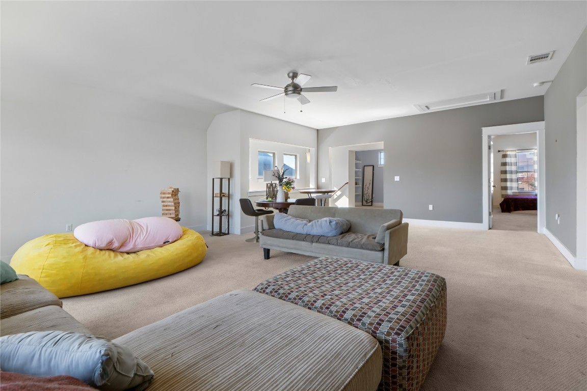 13001 Hymeadow Drive, Unit 31 Austin, TX 78729 - Photo 36 of 40 Carpeted living area featuring a ceiling fan and baseboards