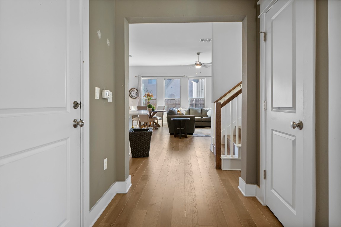 13001 Hymeadow Drive, Unit 31 Austin, TX 78729 - Photo 4 of 40 Entrance foyer featuring light wood finished floors, stairway, and a ceiling fan