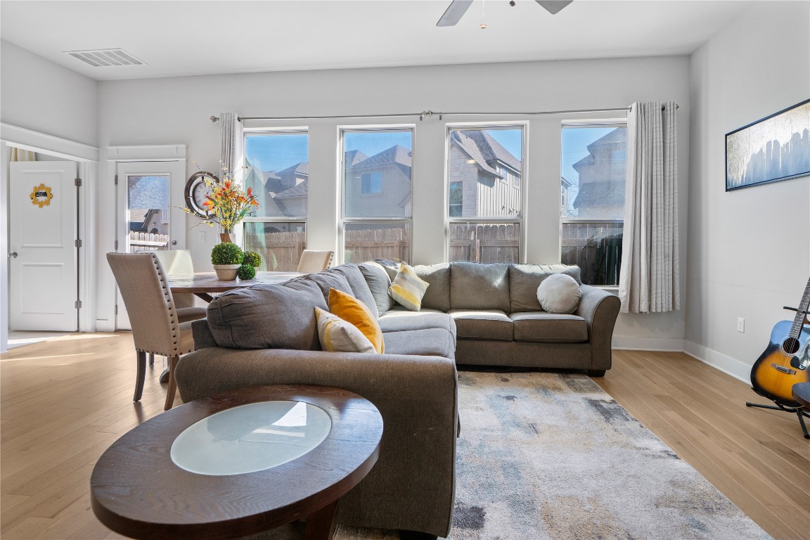 13001 Hymeadow Drive, Unit 31 Austin, TX 78729 - Photo 8 of 40 Living room featuring wood finished floors and a ceiling fan