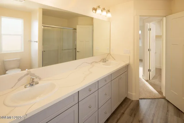 a bathroom with a sink and shower