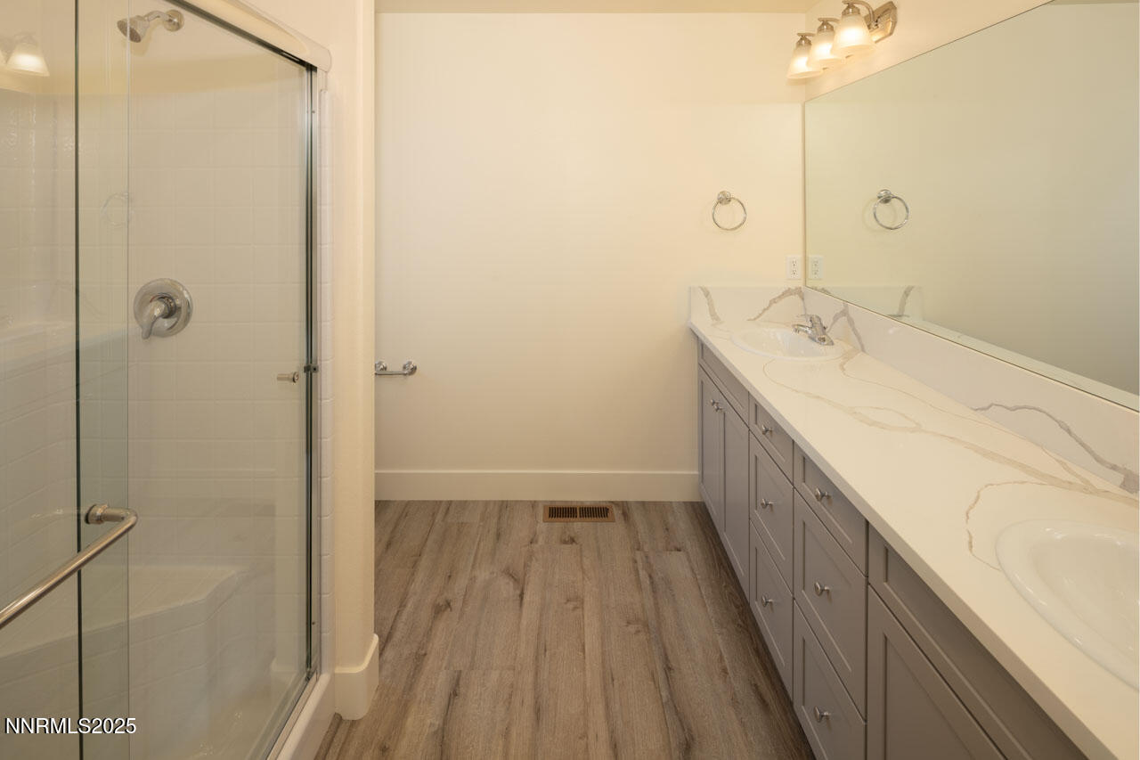 915 Saltbrush Road Dayton, NV 89403 - Photo 10 of 13 a bathroom with a sink and shower