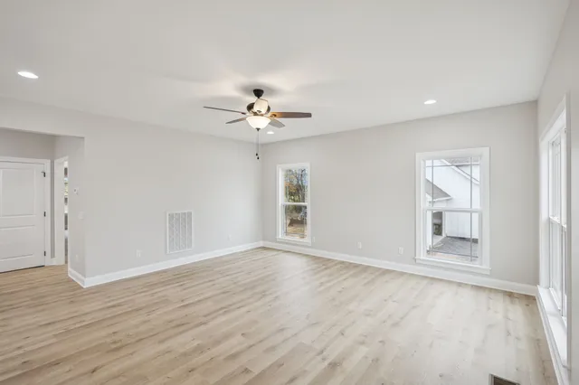 a view of an empty room with a window
