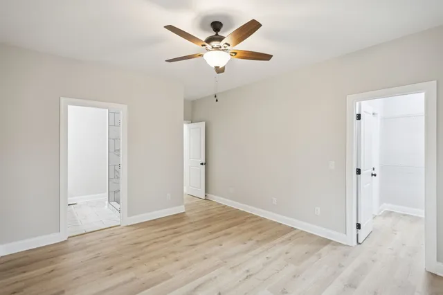 a bathroom with double sink and a mirror