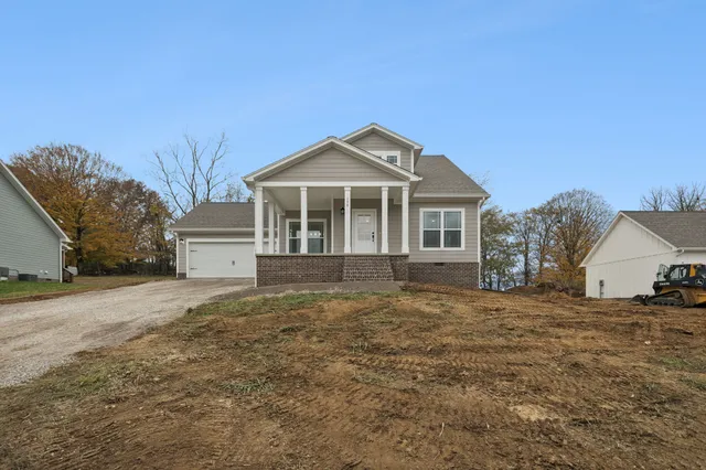 a backyard of a house with large trees