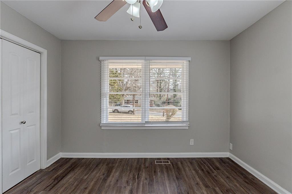 1255 Glen Forest Way Decatur, GA 30032 - Photo 13 of 23 an empty room with wooden floor and windows