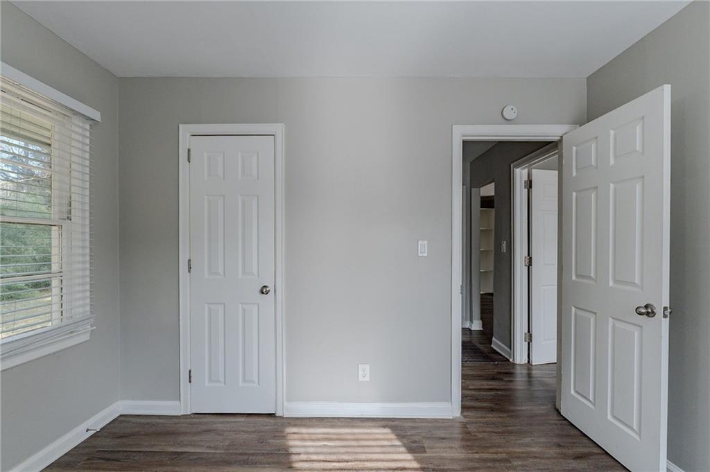 1255 Glen Forest Way Decatur, GA 30032 - Photo 16 of 23 a view of a hallway with wooden floor and closet area