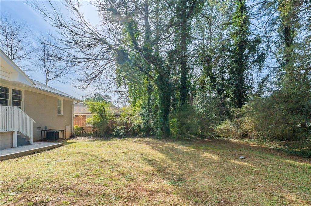 1255 Glen Forest Way Decatur, GA 30032 - Photo 20 of 23 a view of a yard with trees