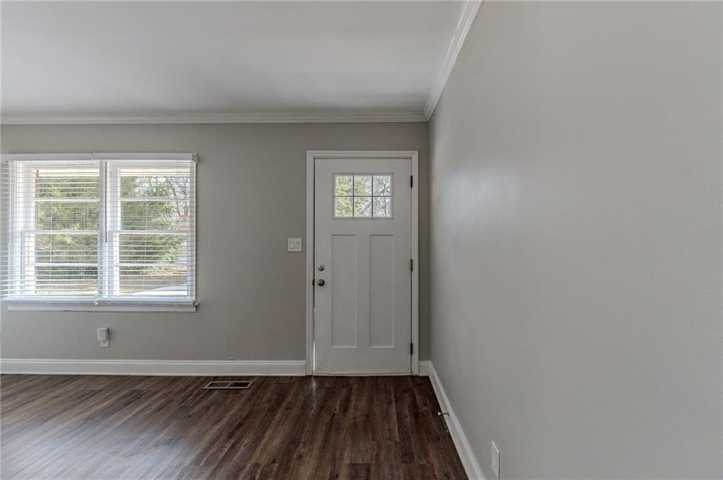1255 Glen Forest Way Decatur, GA 30032 - Photo 2 of 23 an empty room with wooden floor and windows