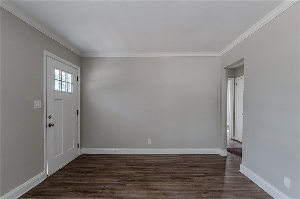 1255 Glen Forest Way Decatur, GA 30032 - Photo 3 of 23 a view of an empty room with wooden floor and a window
