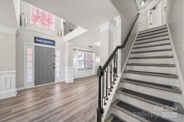 a living room with furniture and a large mirror