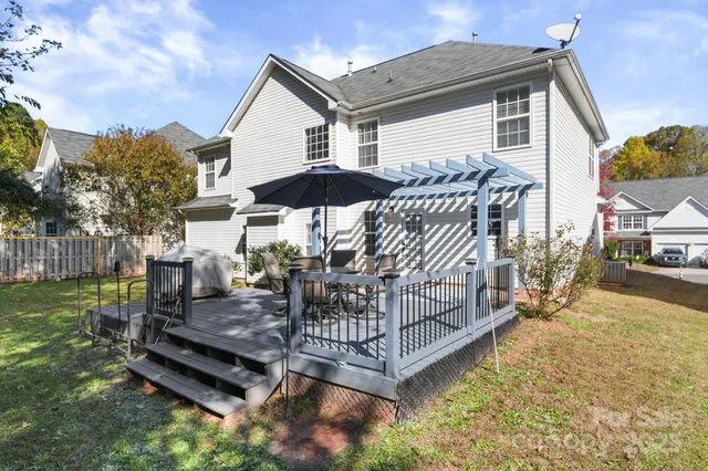 a view of a chairs and table in the patio