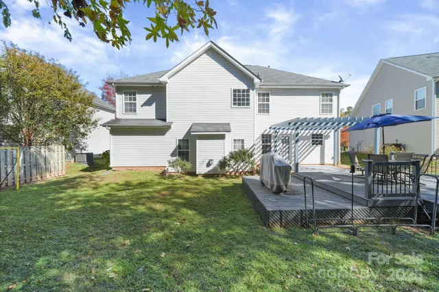 a view of a patio with a table chairs and a patio