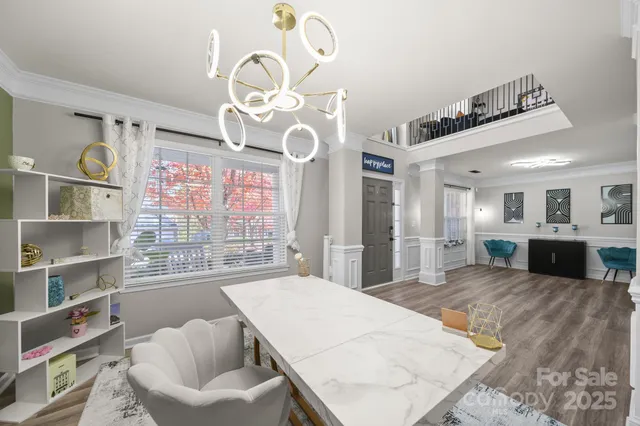 a large white kitchen with a large window