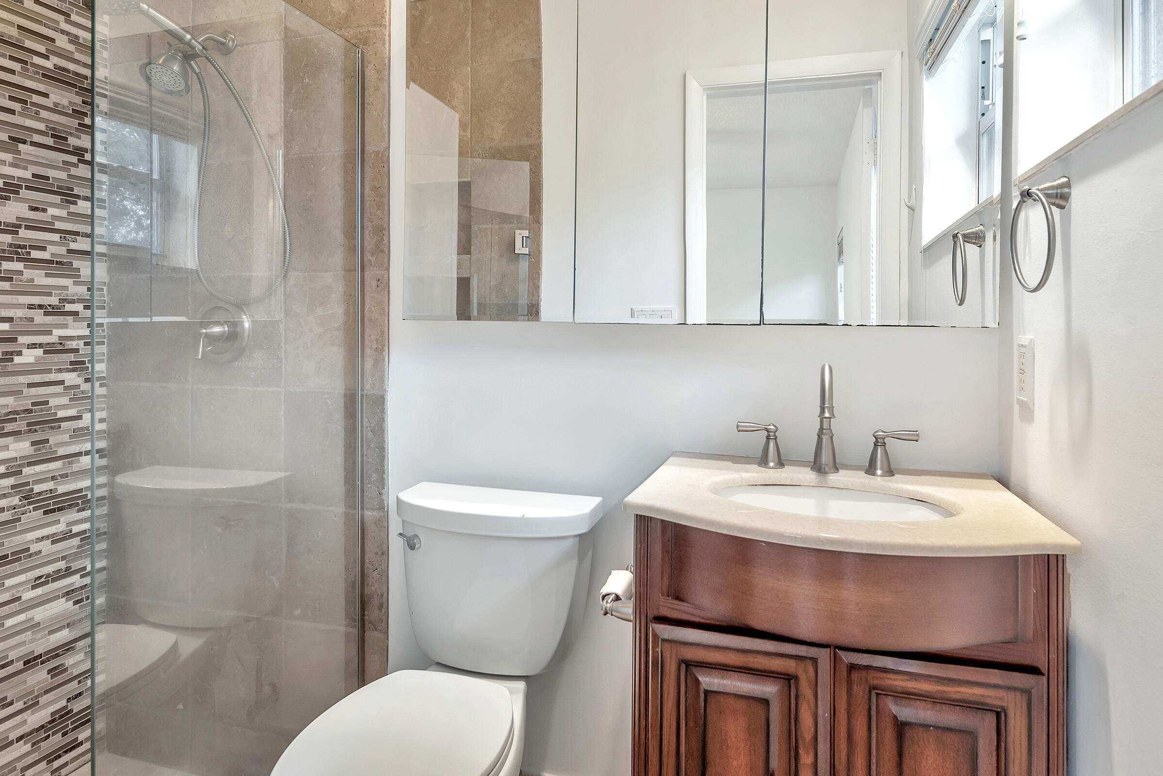 474 Northwest 11th Street Boca Raton, FL 33432 - Photo 35 of 61 a bathroom with a sink toilet and a mirror