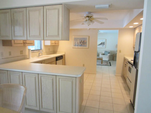 253 Puritan Road West Palm Beach, FL 33405 - Photo 13 of 43 KITCHEN W/VIEW TO FAMILY ROOM