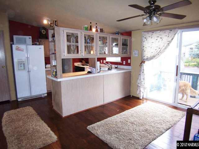 175 Aries Circle Reno, NV 89521 - Photo 5 of 13 a view of kitchen with stainless steel appliances granite countertop wooden cabinets and a counter top space