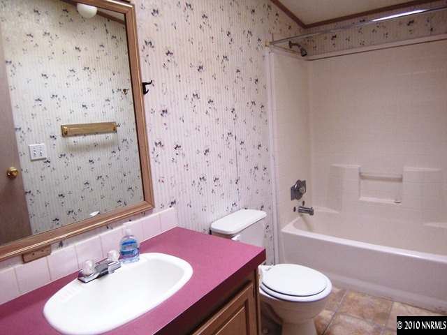 175 Aries Circle Reno, NV 89521 - Photo 8 of 13 a bathroom with a sink toilet and shower