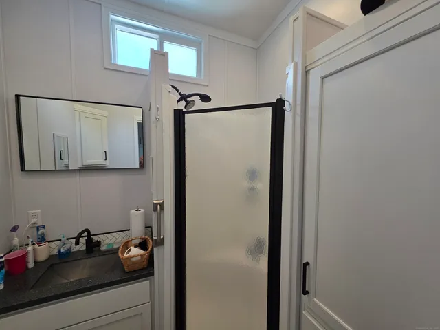 a bathroom with a sink and mirror