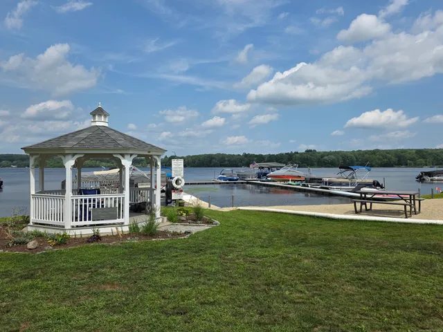 a view of a house with a yard porch and sitting area