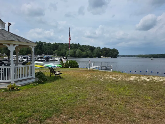 a view of a swimming pool with lawn chairs