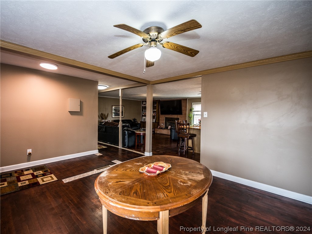 1982 Rowan Road, Unit R Lumberton, NC 28358 - Photo 20 of 43 an open kitchen with a table and chandelier